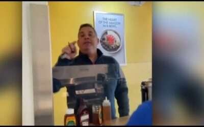Viral video shows customer yelling racist comments at employees, throwing drink